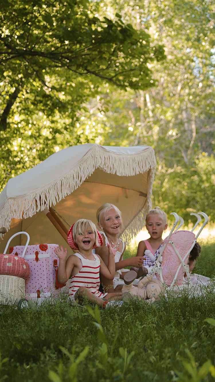 Instagram post by @cierahudson for Olli Ella. Caption reads: Backyard playtime with @olliella 🍓🕊️
All new....