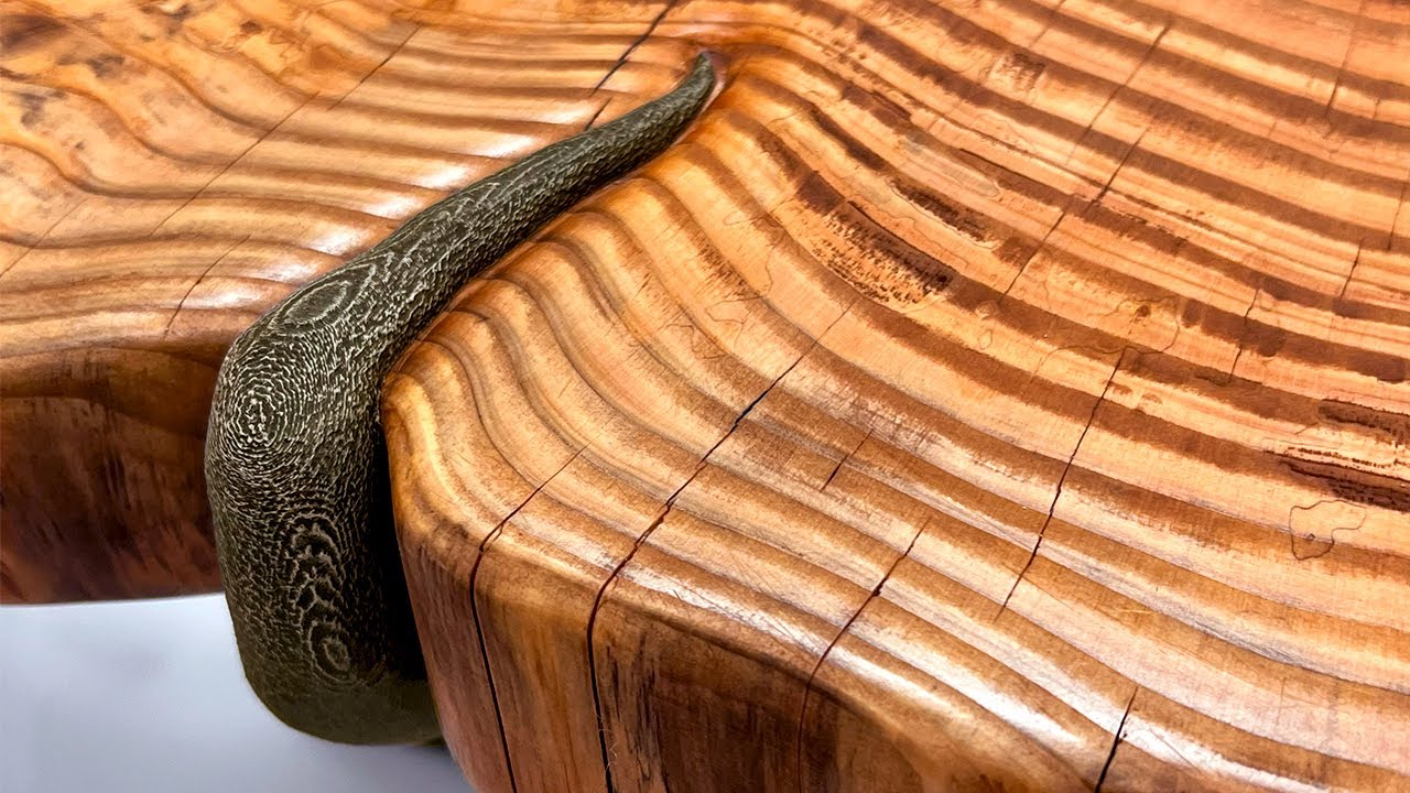 YouTube post by @marmotaworks for Let’s Resin. Caption reads: How I Squished the Wood to Make This Table.