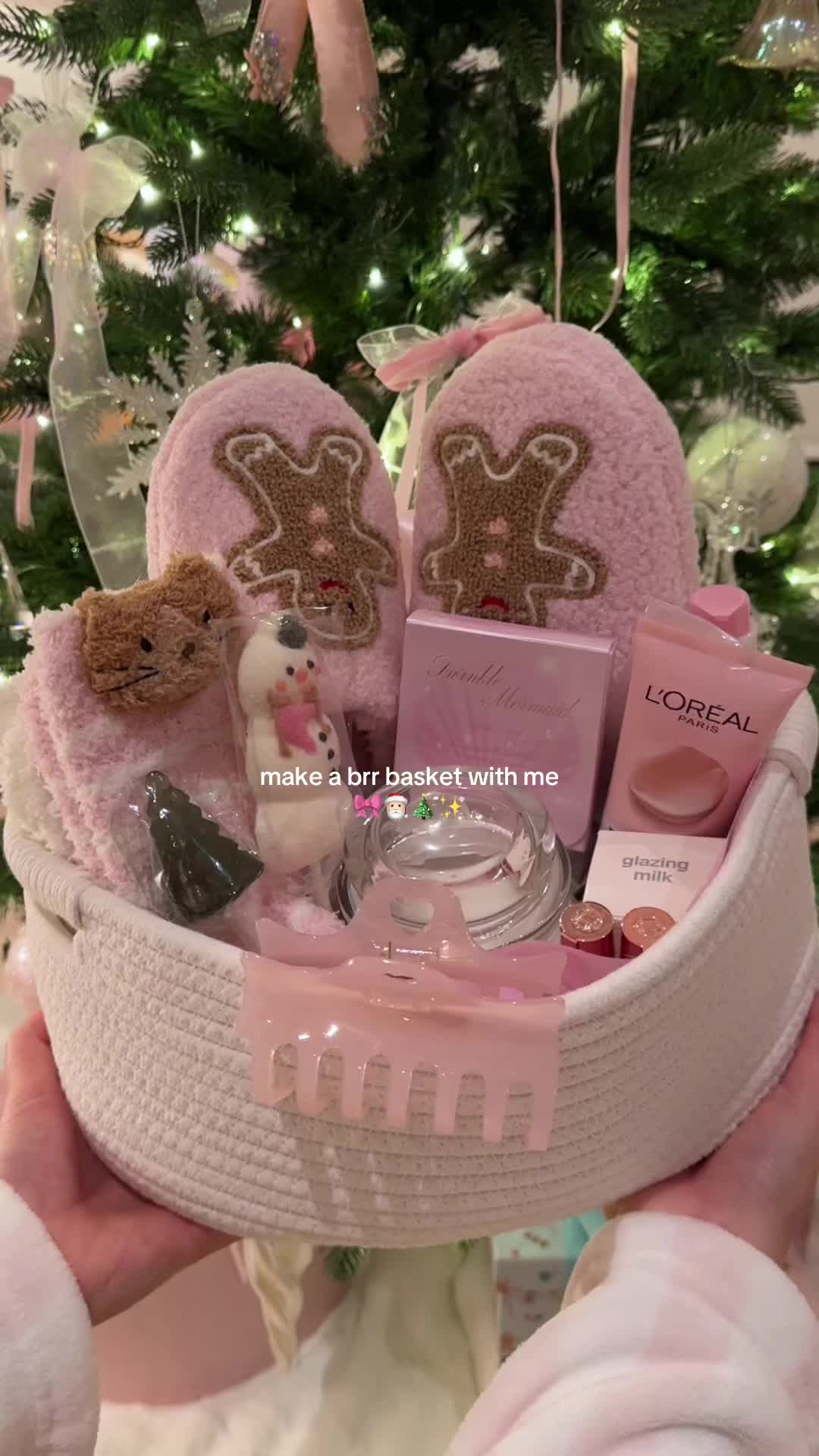 TikTok post by @olafflee for Emi Jay. Caption reads: make a brr basket with me!! #christmas....