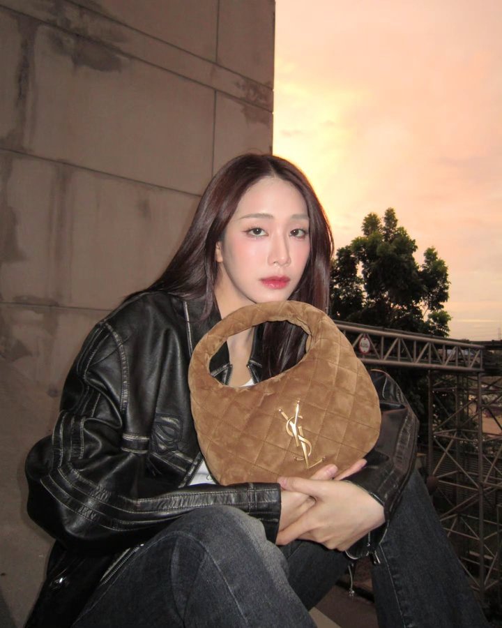 Instagram post by @_.tiya_ for Saint Laurent. Caption reads: till the sun down🌅.