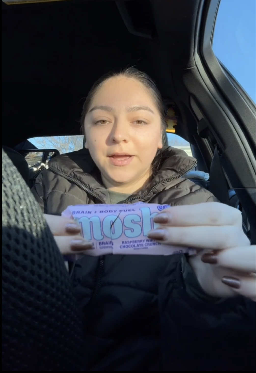 TikTok post by @e__babyy for MOSH. Caption reads: [...] chocolate protein bars 🍫 #proteinbar #mosh....