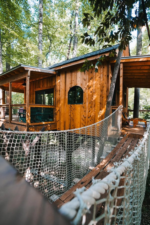 Instagram post by @journey.more for Pakt Bags. Caption reads: Would you agree that this treehouse is magical??😍....