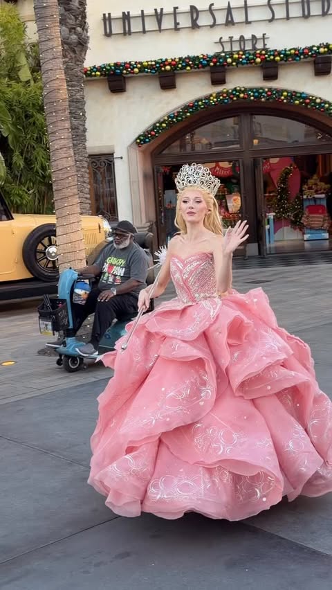 Instagram post by @itschristianeverywhere for Universal Studios Hollywood. Caption reads: Caught the Good Witch on her power walk magic in....