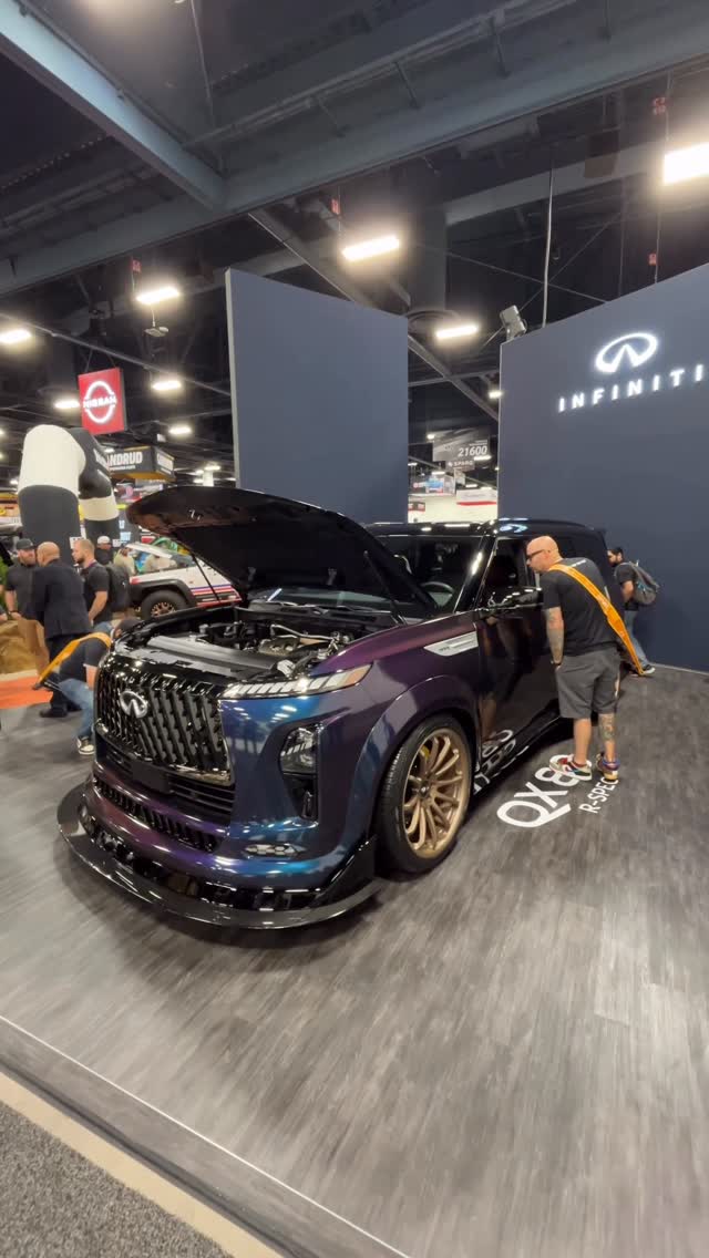 Instagram post by @carbuzz for INFINITI USA. Caption reads: Infiniti put a GT-R engine in a QX80, and that was....