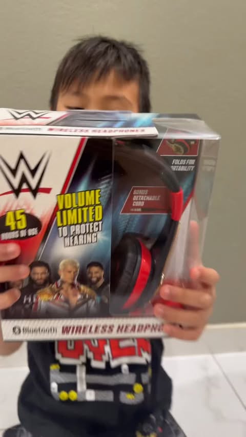 Instagram post by @mila_xavi for eKids. Caption reads: Have you seen eKids new WWE-themed headphones?....