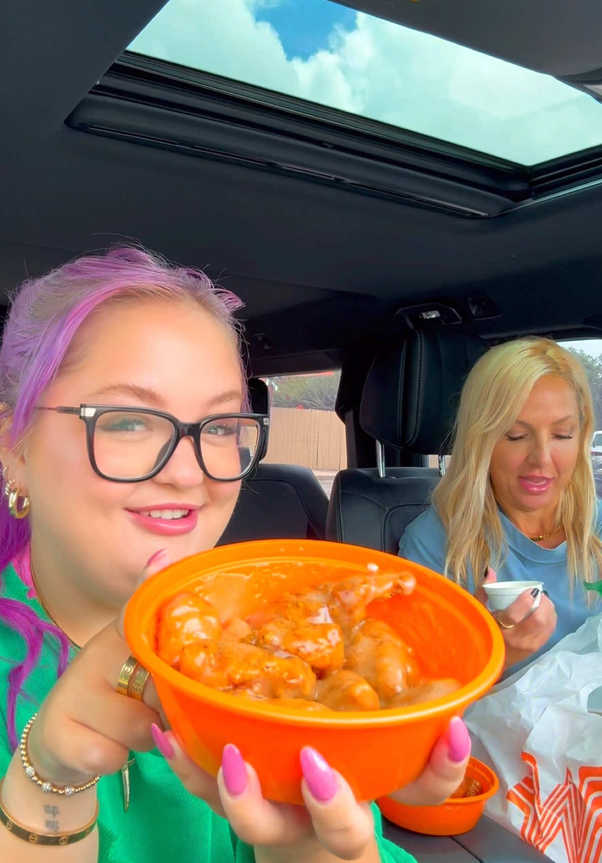 TikTok post by @laurengodwin for Whataburger. Caption reads: Come with me to try the #WhataWings from....