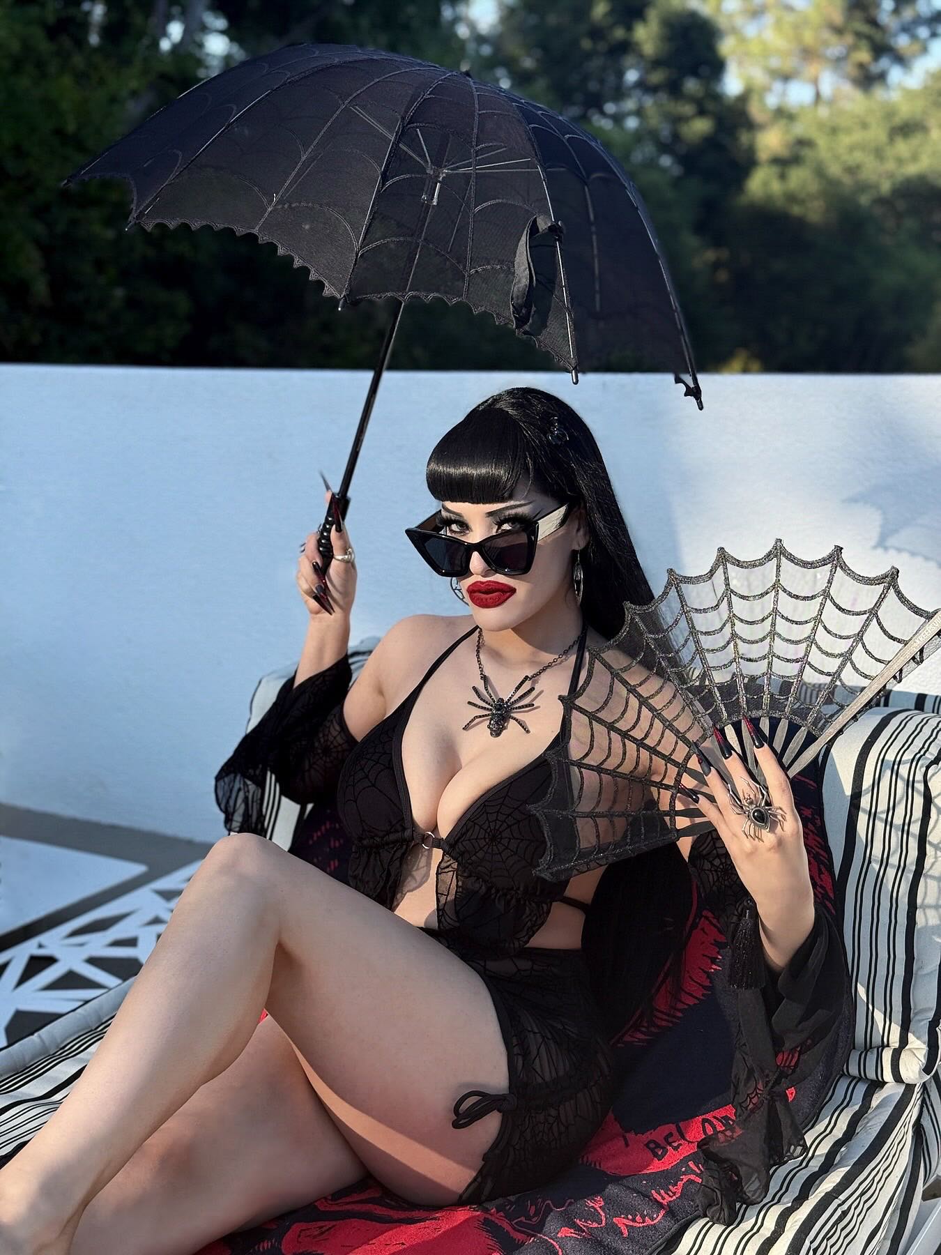 Instagram post by @victoriavenin for ROMWE. Caption reads: 🕸️🌊🦇🖤🦇🌊🕸️

Enjoying my Summerween 🎃☀️....