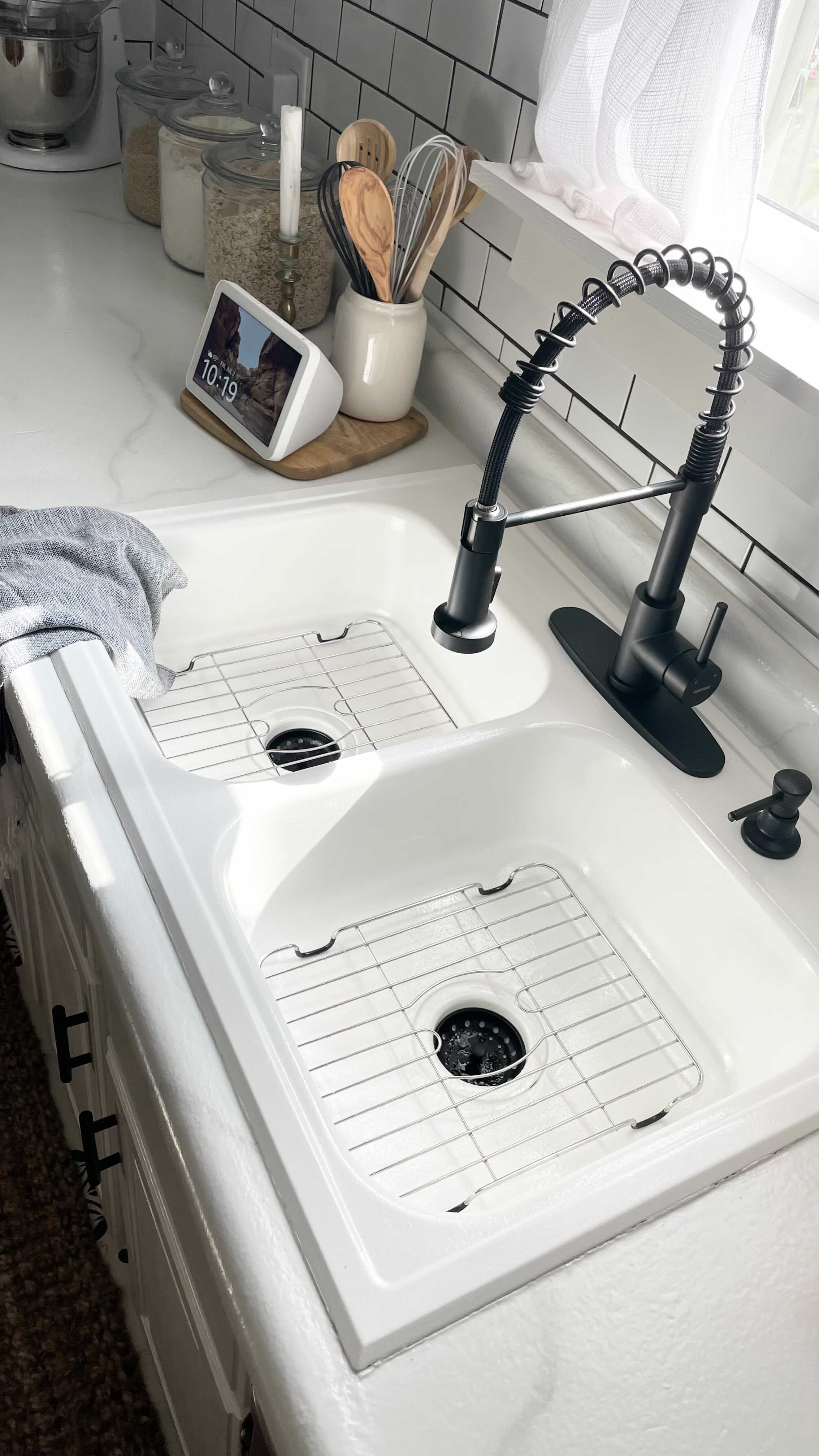 Instagram post by @diyobsessedhome for Country Living. Caption reads: Before and After sink makeover is here! Can you....