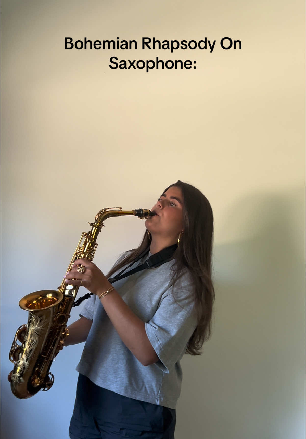 TikTok post by @isaxophone_ for Universal Musiek. Caption reads: BOHEMIAN RHAPSODY 🎶🤍 #bohemianrhapsody #queen ....