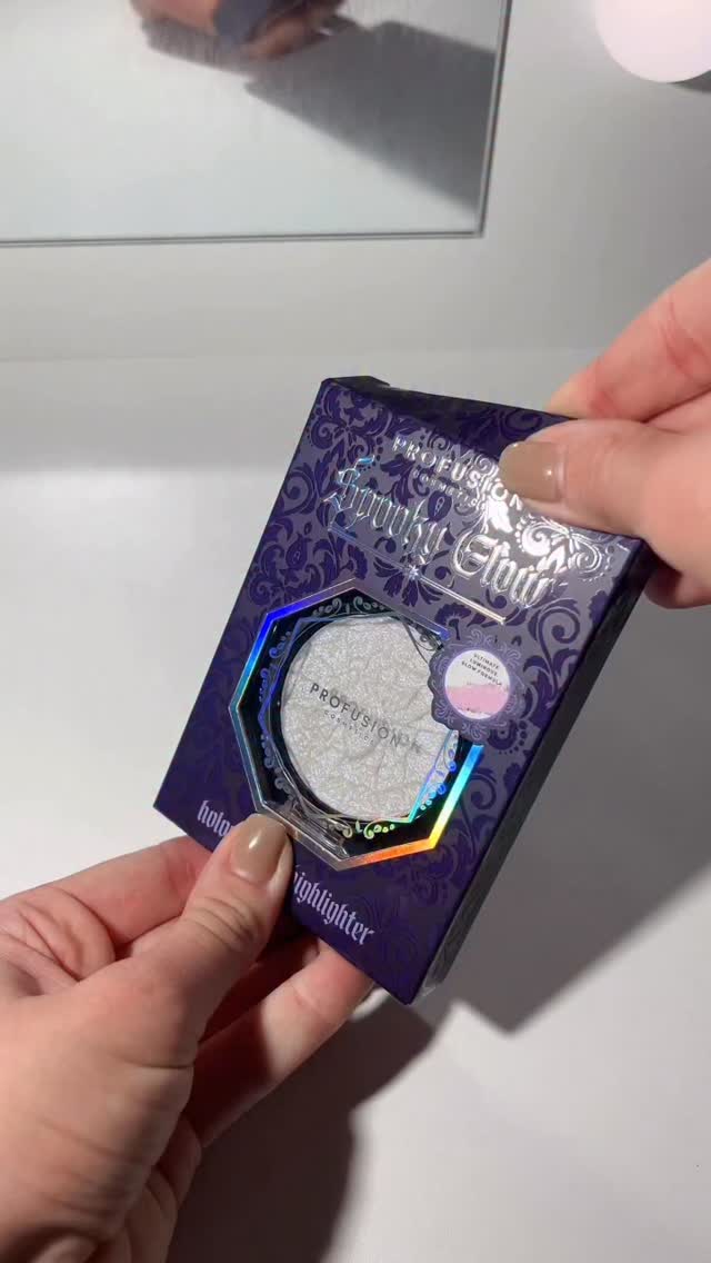 Instagram post by @_cloebeauty for Profusion Cosmetics. Caption reads: Spooky glow holographic highlighter 🕸️👻....
