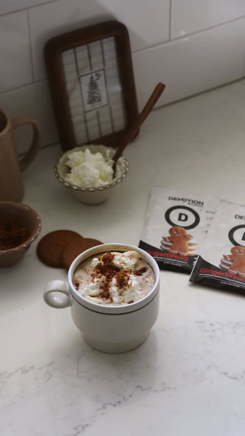 Instagram post by @ashleighbovard for Devotion Nutrition. Caption reads: This high-protein gingerbread latte tastes like....