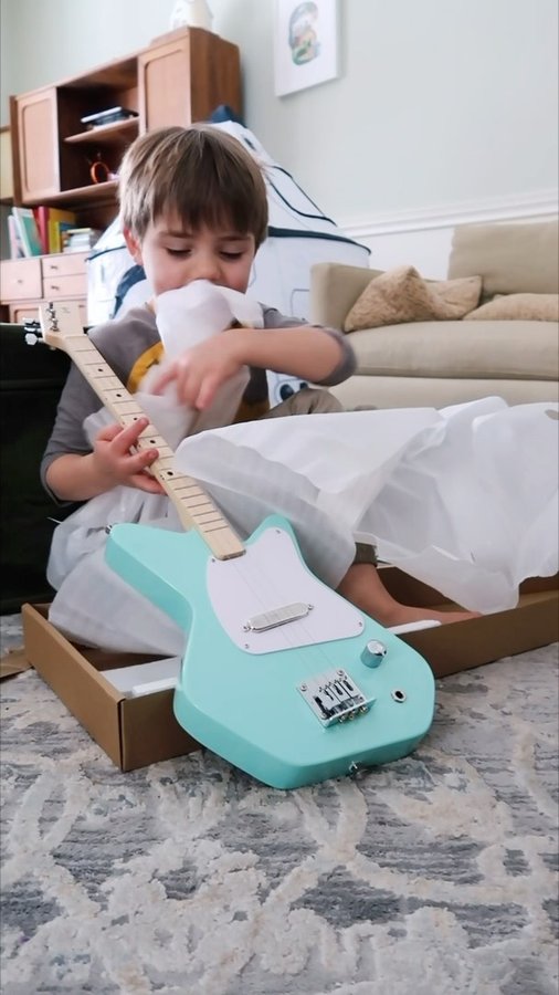 Instagram post by @ambientendeavors for Loog Guitars. Caption reads: Care package just landed from @loogguitars 😍....