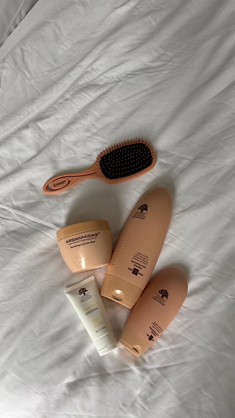 Instagram post by @olikoo__ for Arganmidas. Caption reads: [...] to romanticize your hair routine ✨....