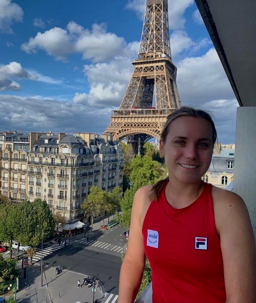 Instagram post by @sofia.kenin for SmileDirectClub. Caption reads: Smiling my way into Paris with Smile Direct Club!....