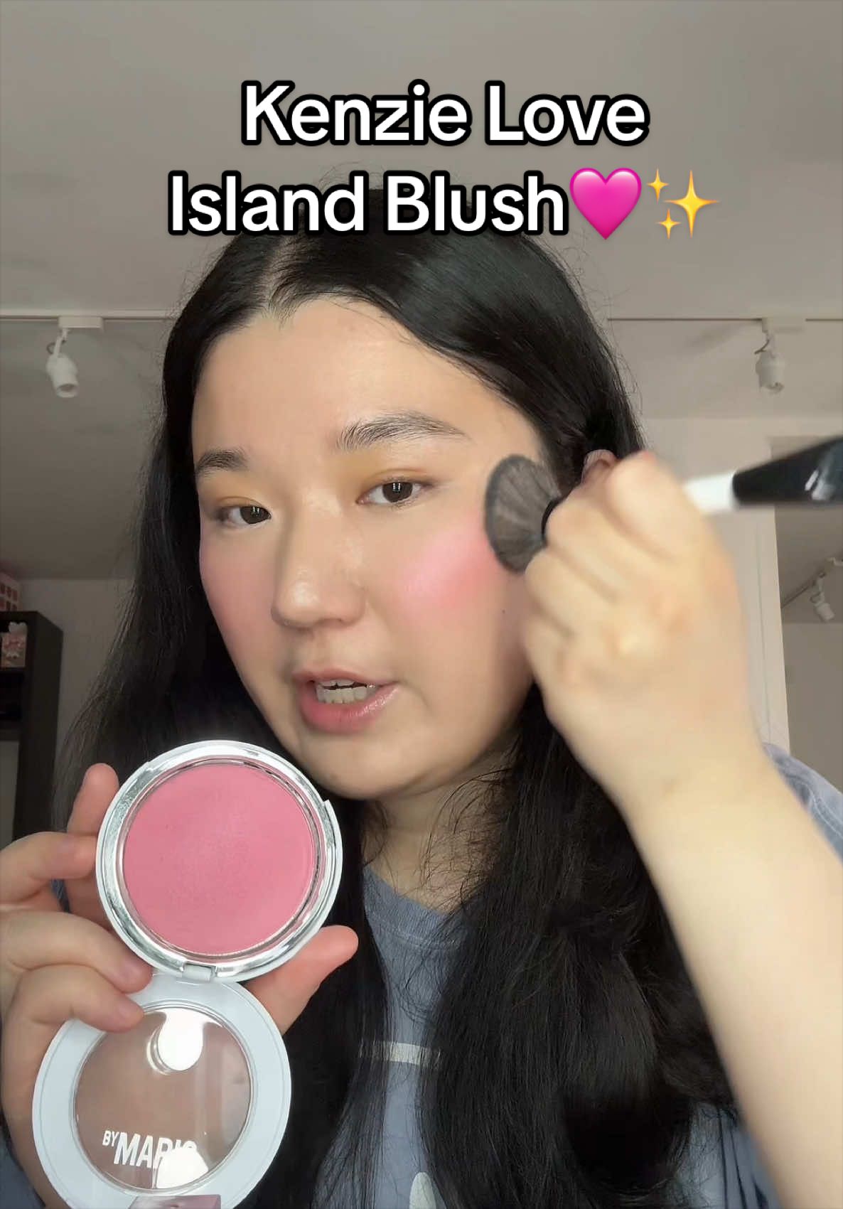 TikTok post by @loverlucylol for Marylia Scott Cosmetics. Caption reads: [...] baby pink glowy blush flush. ✨ Marylia Scott....
