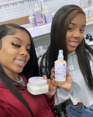 Instagram post by @tm.twins for En Love Beauty. Caption reads: [...] WORKS FOR OUR NATURAL HAIR & WIGS....