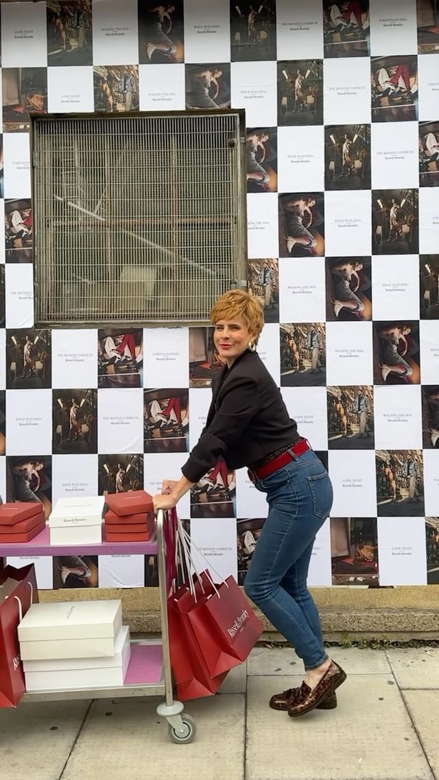 Instagram post by @charityshopsue for Russell & Bromley. Caption reads: Number 8...I’m never late! An evening of fun &....