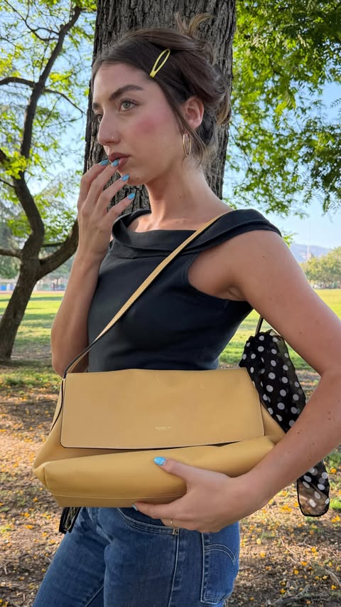 Instagram post by @zoifish for Coach. Caption reads: this bag is my new obsession <3 @coach #coachNY....