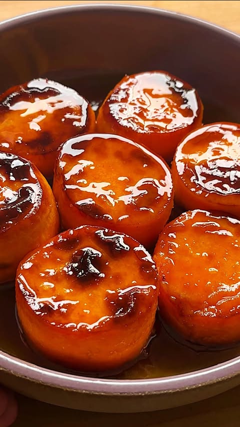 Instagram post by @carolinagelen for NYT Cooking. Caption reads: FONDANT SWEET POTATOES WITH HONEY BUTTER AND....