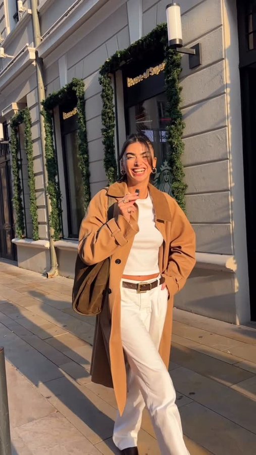 Instagram post by @selennergiz for UNIQLO. Caption reads: OOTD🤎 #fyp #ootd #reklam 

Trench @zara 
T shirt....