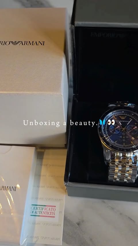Instagram post by @liveabouts for Wowcher. Caption reads: [...] unboxed this Emporio Armani watch from....