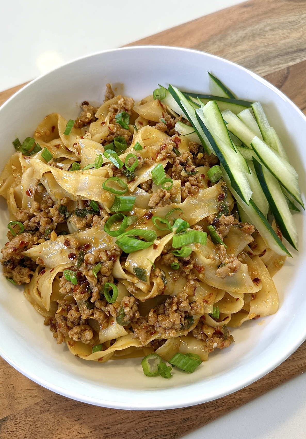 TikTok post by @johnandchelseaa for Kikkoman USA. Caption reads: The kids were craving Chili Garlic Noodles for....