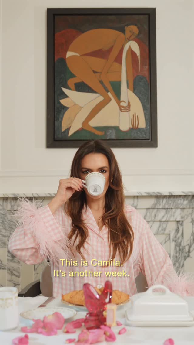 Instagram post by @camilacarril for Carolina Herrera. Caption reads: A day in my life with La Bomba 🦋 @carolinaherrera....