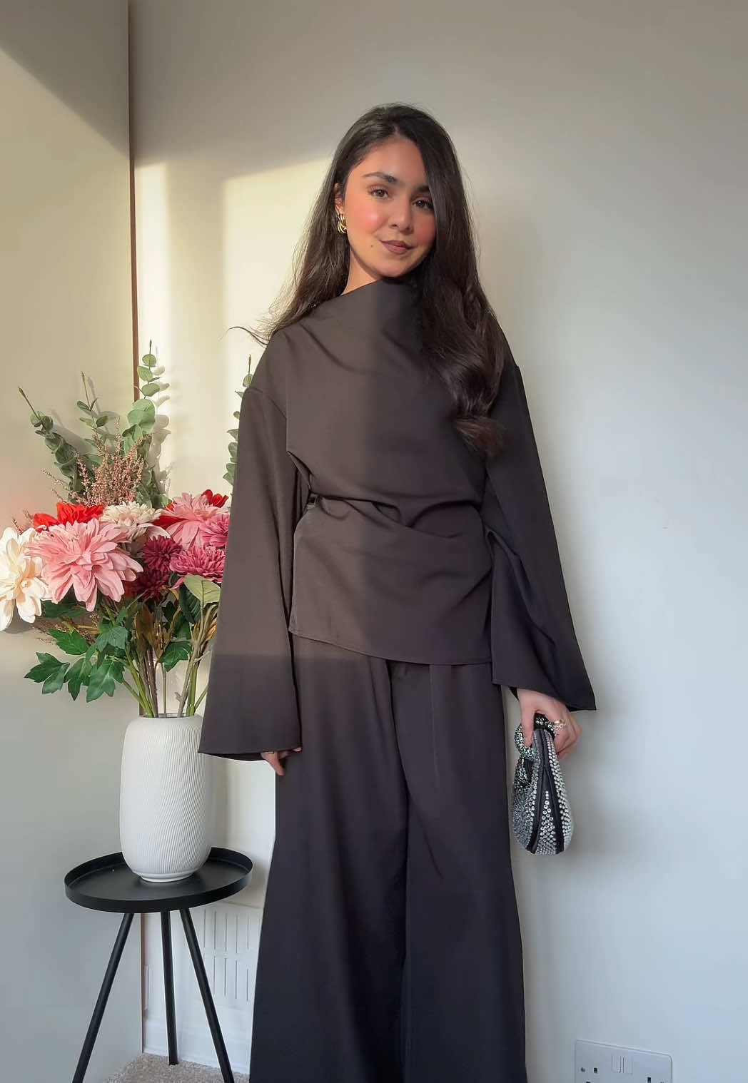 TikTok post by @iitszainabb for emlavish. Caption reads: This set is giving 😍🖤  @emlavish #fyp #nyeoutfit....