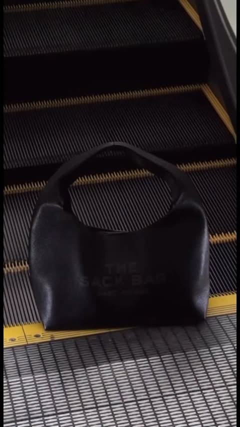 Instagram post by @nelsoncarolyn_ for Marc Jacobs. Caption reads: secured my @marcjacobs sack bag #ad #streetwear....