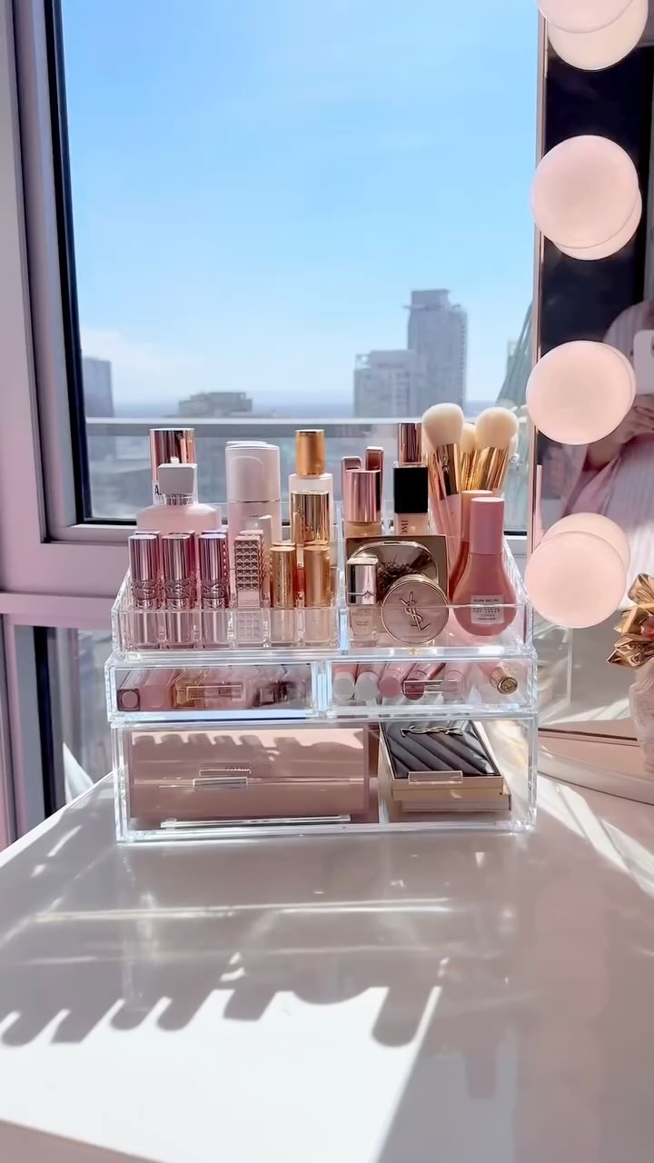 Instagram post by @thaniasofficial for The Container Store. Caption reads: Nothing beats an actual luxury acrylic organizer ✨....