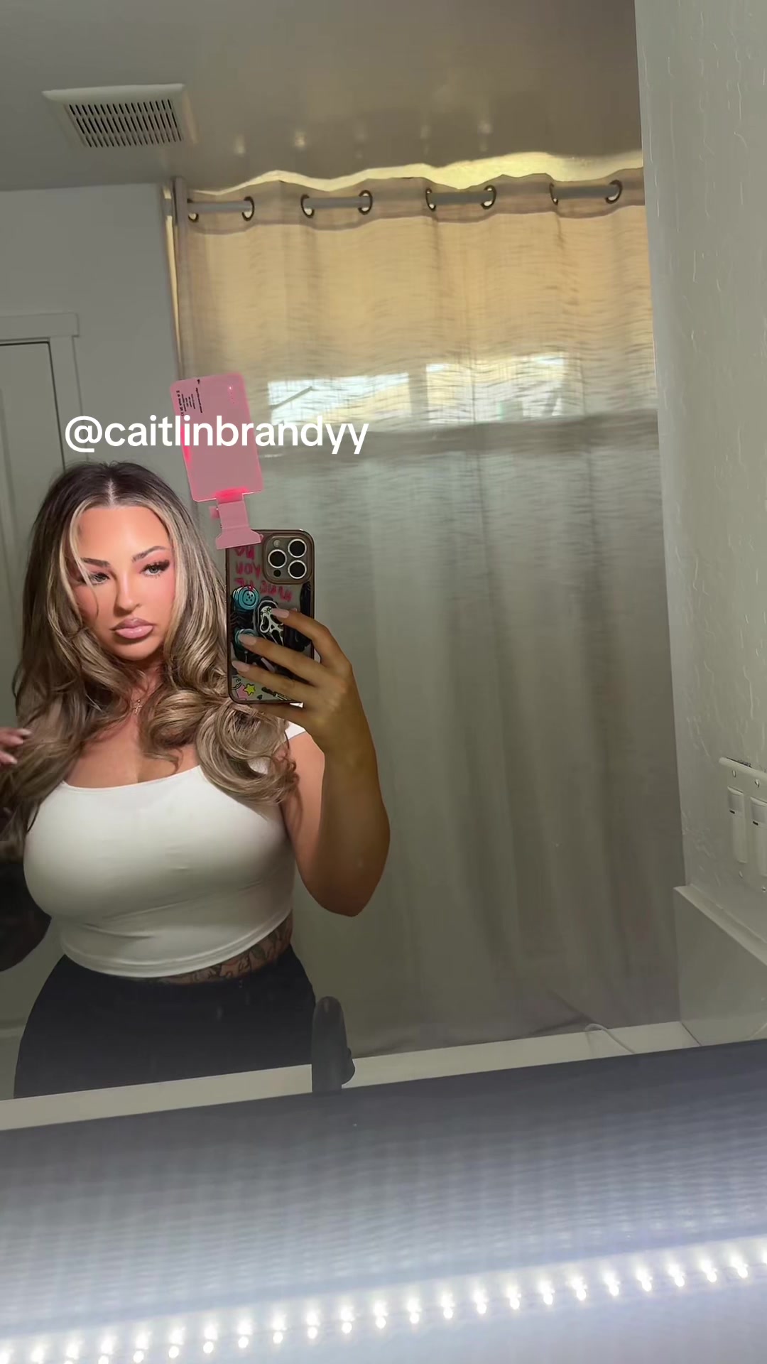 TikTok post by @caitlinbrandyy for BELLAMI Hair. Caption reads: [...] #xybca #gymtok #hairtok @Bellamihair.