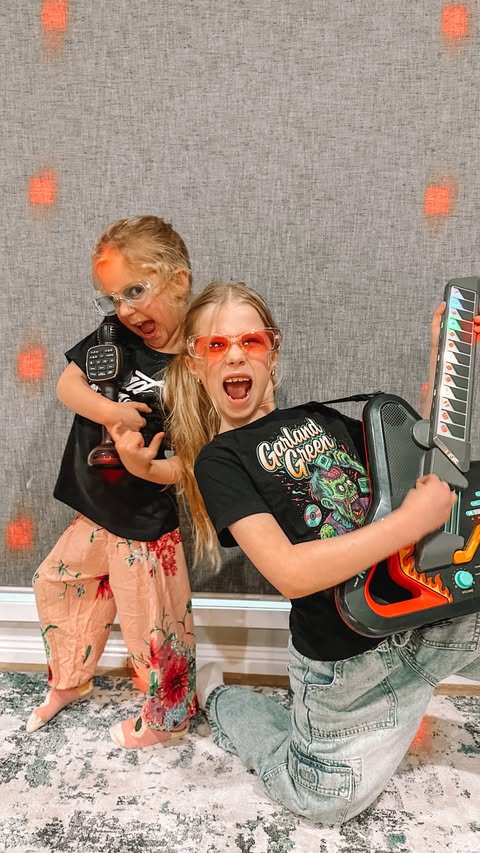 Instagram post by @caity_cannan for VTech USA. Caption reads: 🎸🎤 The girls have officially turned into....