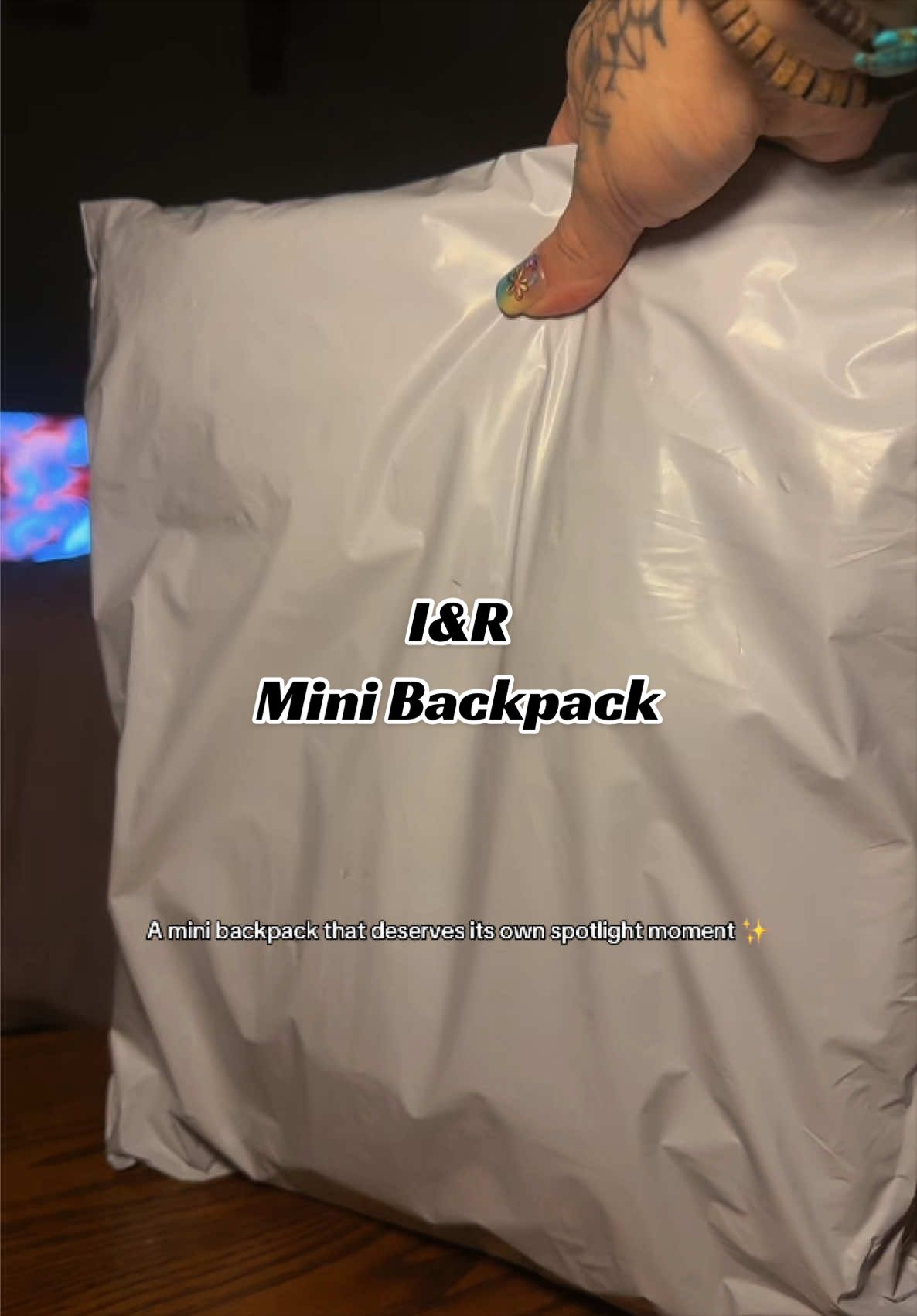 TikTok post by @mamawolf_littlewolf_ for Iris And Rainbow. Caption reads: [...] @Rainbow Boutique LLC #minibackpack....