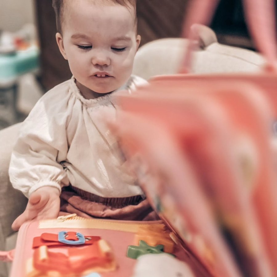 Instagram post by @mama_2_lola_priya for Toddla. Caption reads: [...] calm with the ultimate busy board from....