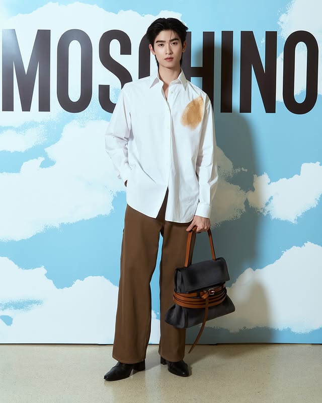 Instagram post by @thomaschungmanirat for Moschino. Caption reads: Discover the artistry of Moschino at its newest....