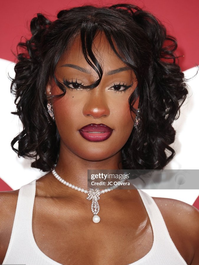 Instagram post by @temssource for Getty Images. Caption reads: Tems stuns at the GQ man of the year ✨.