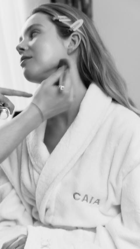 Instagram post by @isabellehartmann for CAIA Cosmetics. Caption reads: [...] Wake Me Up Complexion Enhancer from....
