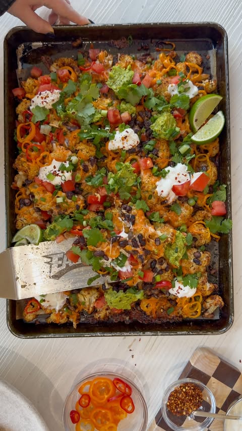 Instagram post by @everything_delish for J.Crew. Caption reads: loaded cauliflower nachos topped with homemade....