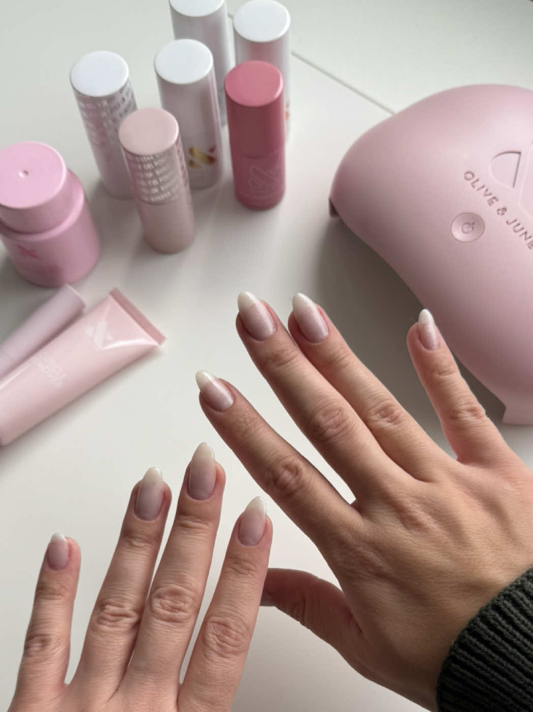 TikTok post by @alexacastino for Olive & June. Caption reads: New @Olive & June builder gel! 💅🏼 #oliveandjune....