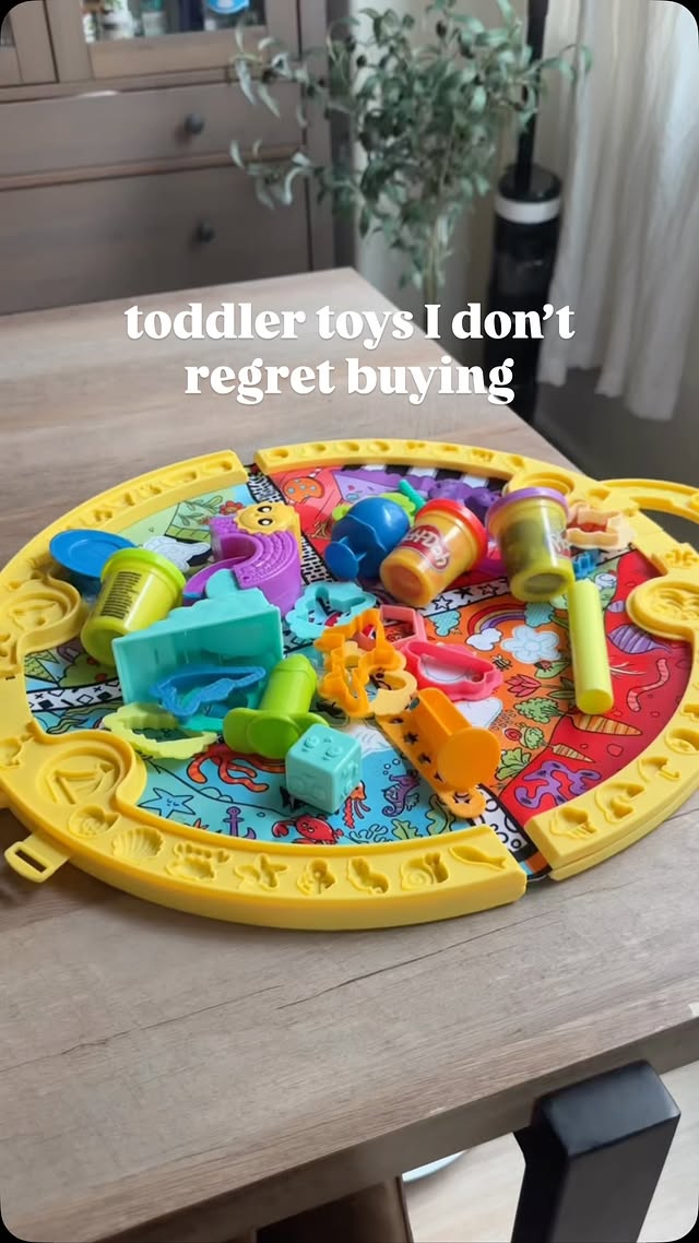 Instagram post by @byjamiemichelle for Play-Doh. Caption reads: 10 toddler toys I don’t regret buying! Comment....
