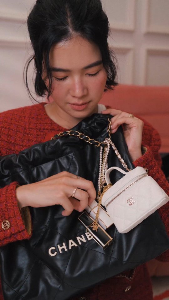 Instagram post by @proud_olives for CHANEL. Caption reads: Let’s unbox the @chanel.beauty Holiday....