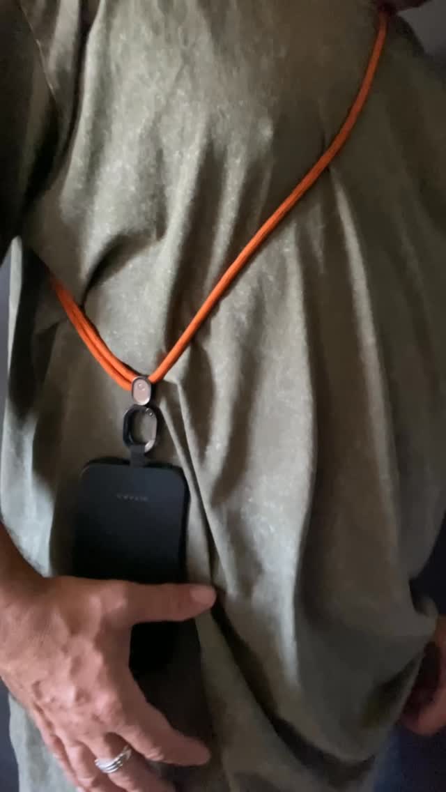 Instagram post by @carlosdnobrega for Orbitkey. Caption reads: Crossbody Phone Strap! 👋📱 Hands-free,....