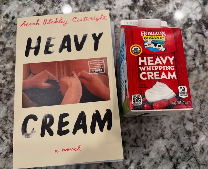 Instagram post by @stacy40pages for Simon & Schuster. Caption reads: 𝐇𝐞𝐚𝐯𝐲 𝐂𝐫𝐞𝐚𝐦 by Sarah Blakley-Cartwright.....