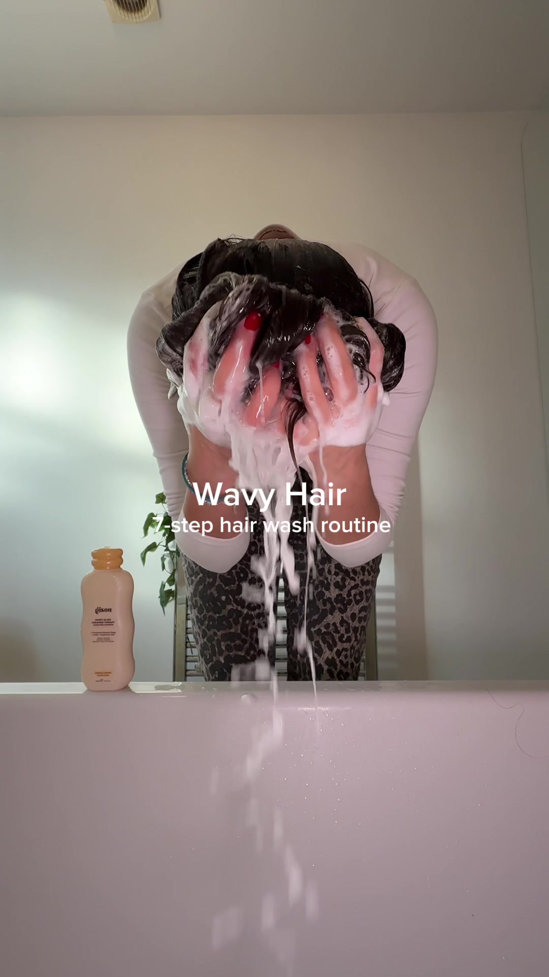 TikTok post by @lassabi for Gisou. Caption reads: [...] hair wash routine using a full range of....