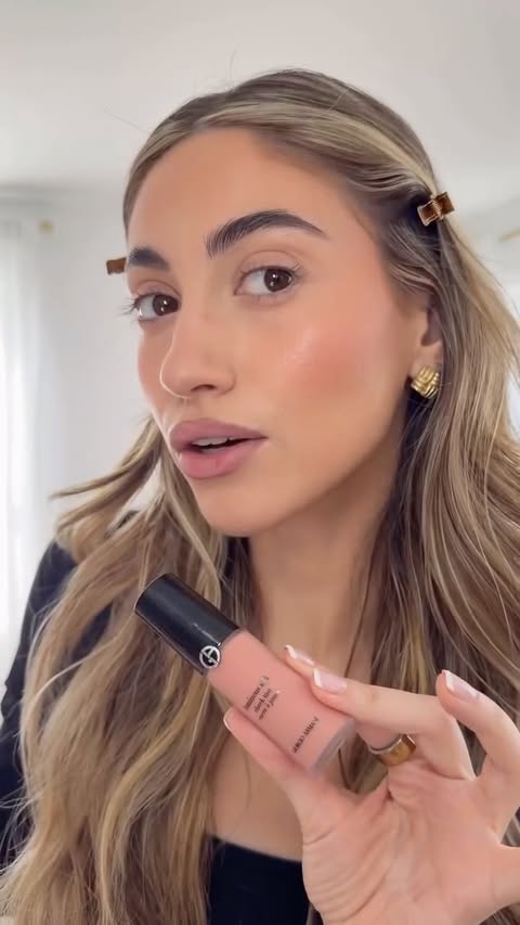 Instagram post by an influencer for Armani beauty. Caption reads: [...] @cgonzalezbeauty 💋 using @Armanibeauty ,....