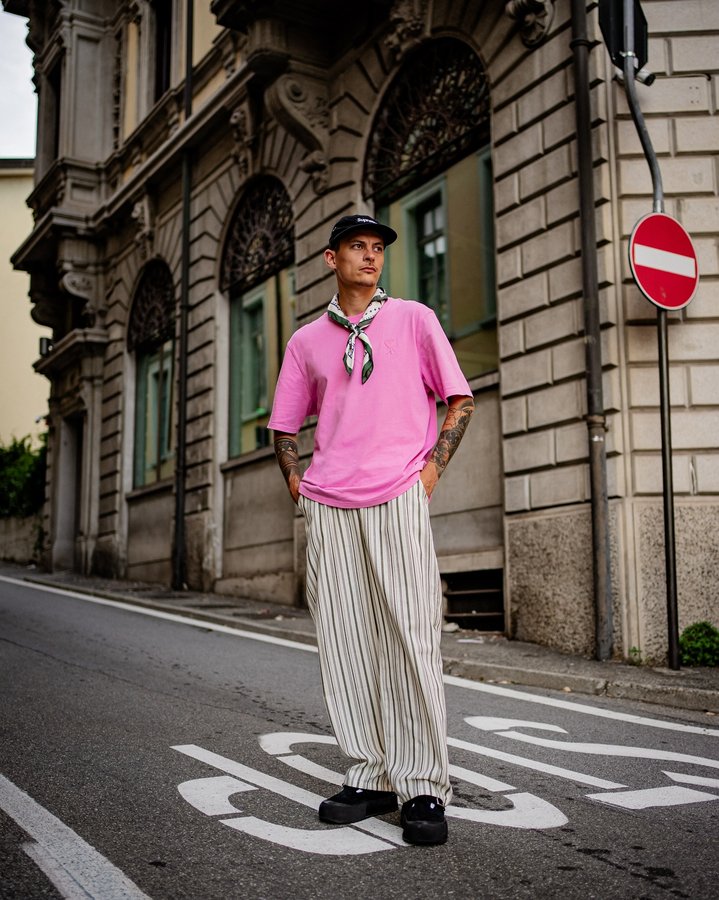 Instagram post by @der_mamo for AMI Paris. Caption reads: [...] 
Scarf @prohibitedclo 
Tee @amiparis 
Pants....