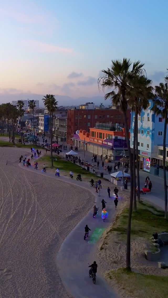 Instagram post by @venice_beach_boardwalk for Visit California. Caption reads: No place quite like Venice Beach 🌴🌅

#dronevideo....