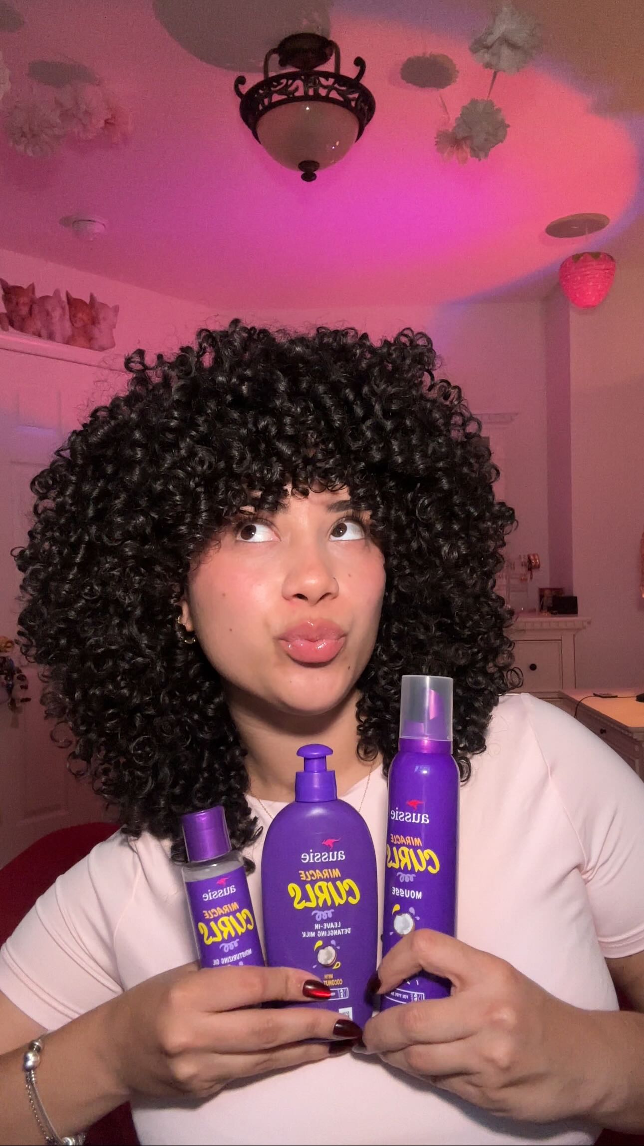 Instagram post by @love_elainne for Aussie Hair. Caption reads: Let me know if you guys stock up on....