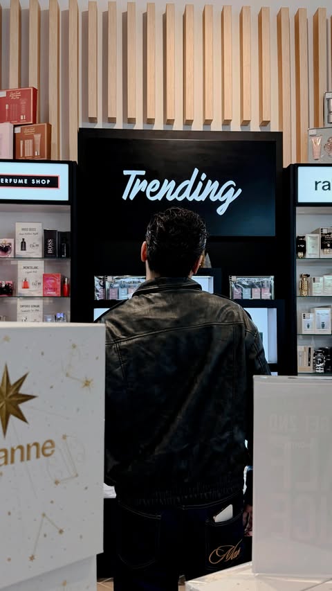 Instagram post by @calebdexouza for The Perfume Shop. Caption reads: #AD | A MERRY SPRITZMAS with @theperfumeshop....