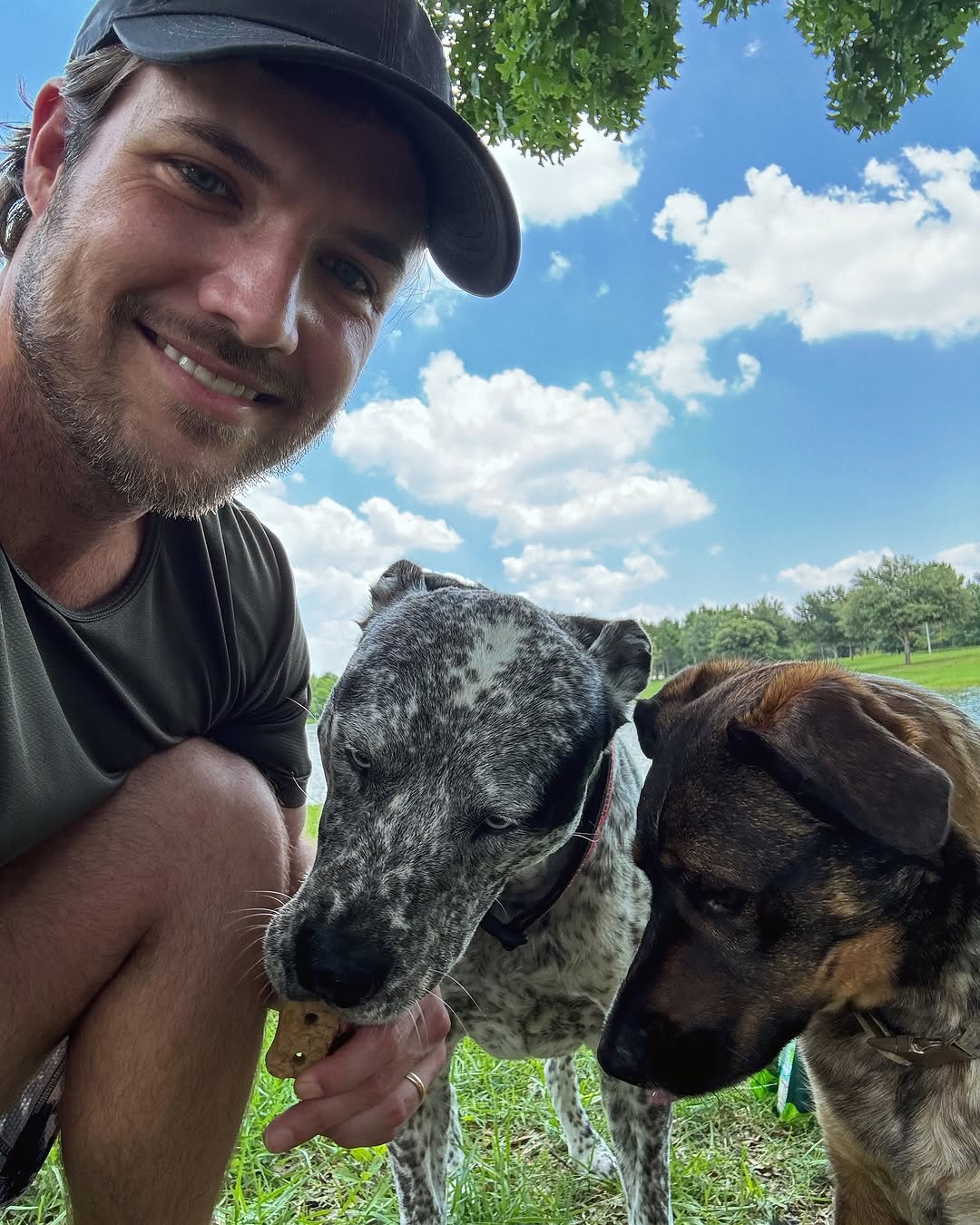 Instagram post by @jordan__kimball for Earthborn Holistic Pet Food. Caption reads: The key to a fun summer afternoon at the pawrk 🐾....